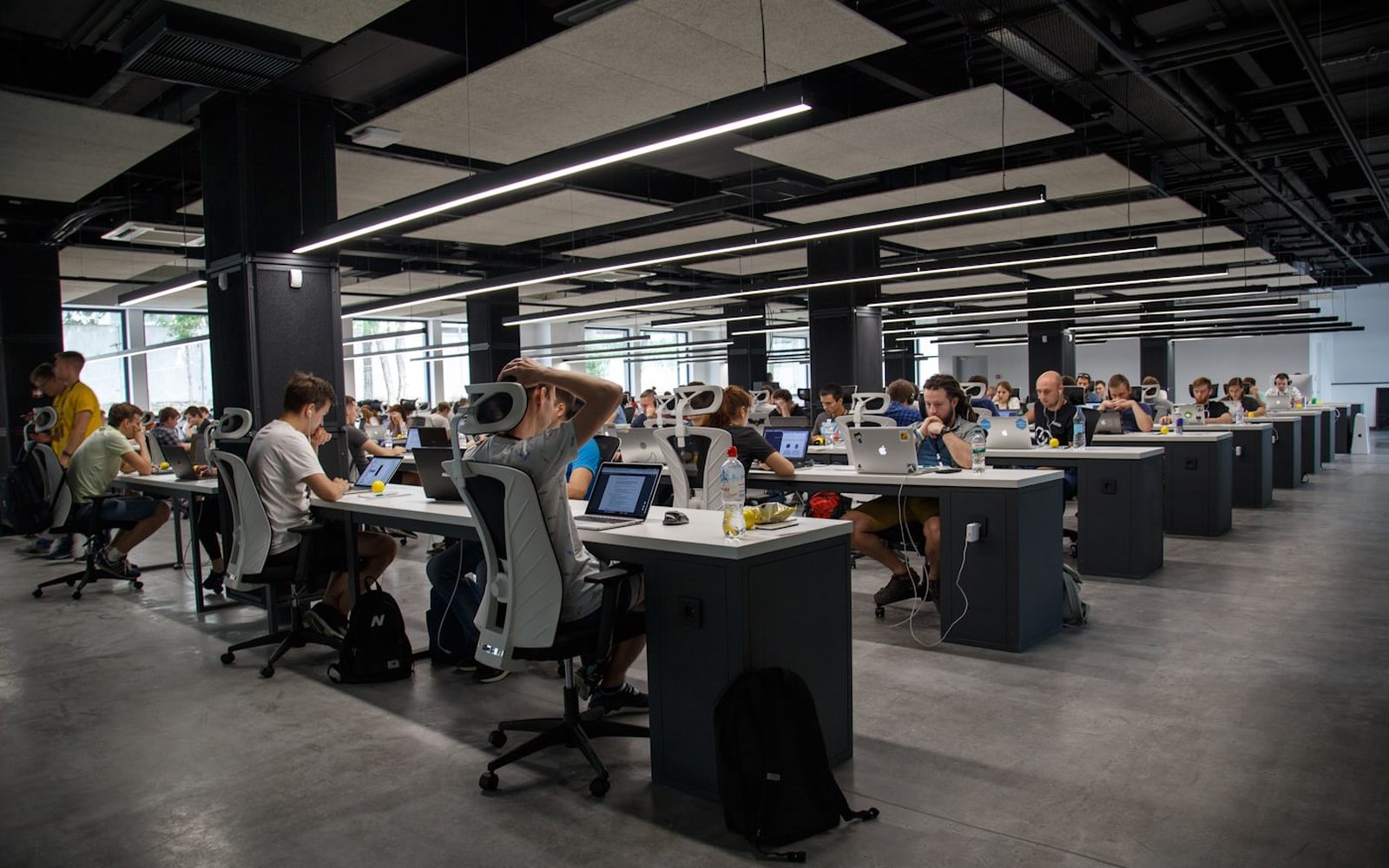 A large operations floor of people working at screens